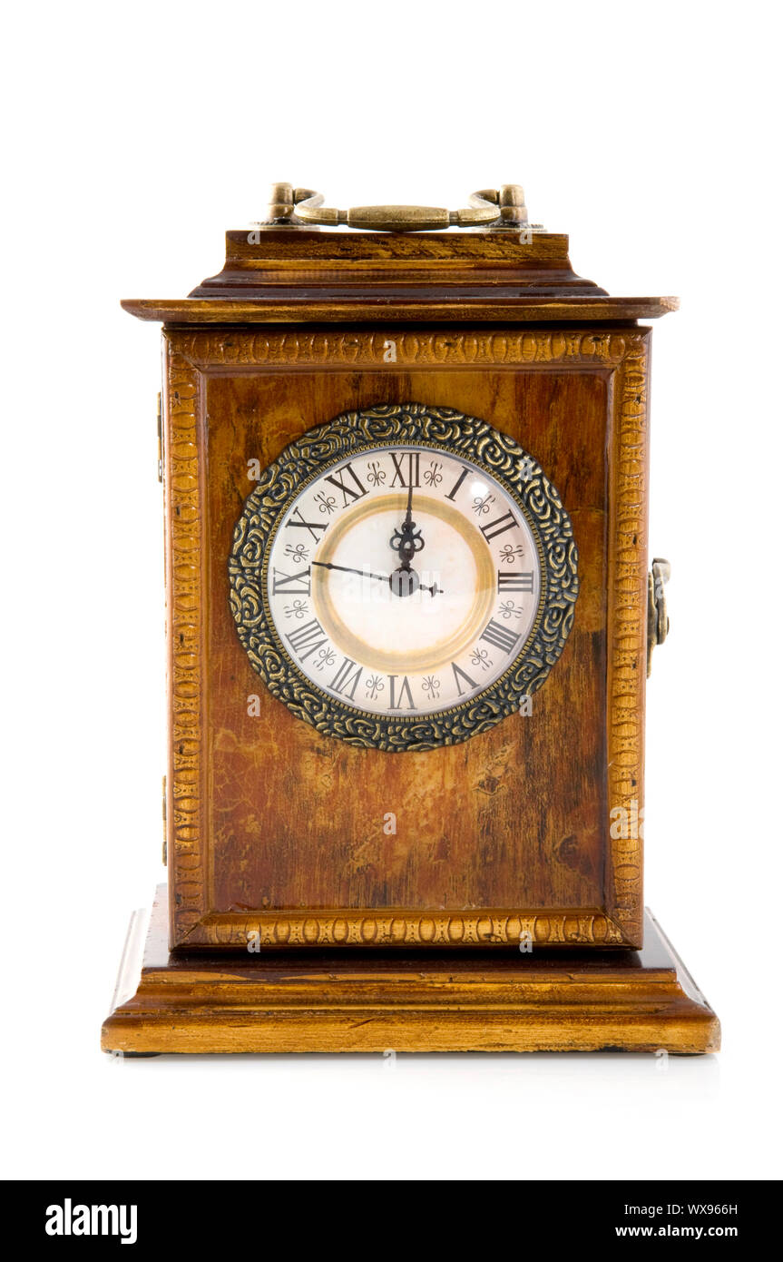 an antique clock at twelve o`clock Stock Photo